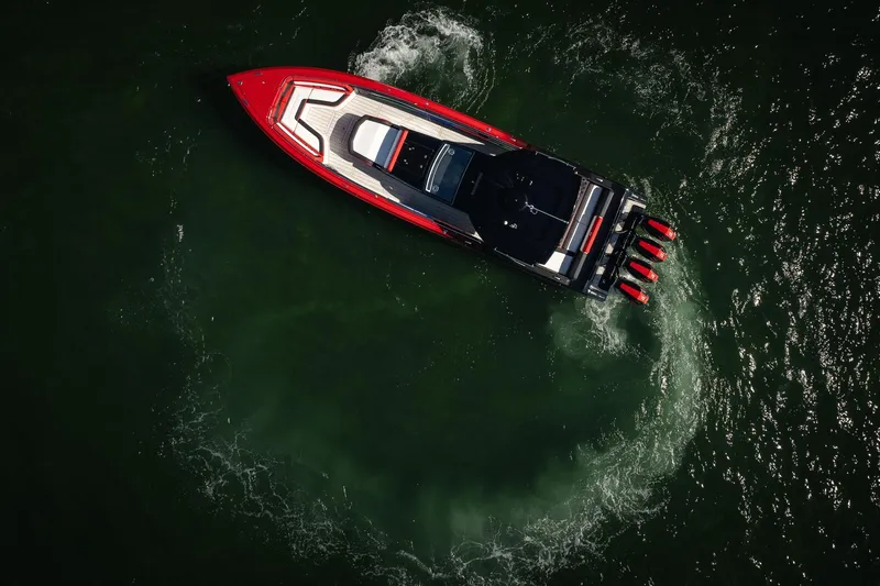 Slide: The Image of Aerial view of 2025 Cigarette 41 Nighthawk speedboat making a circular wake. - 62