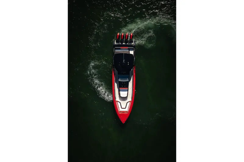 Slide: The Image of Aerial view of 2025 Cigarette 41 Nighthawk boat cruising on water. - 63