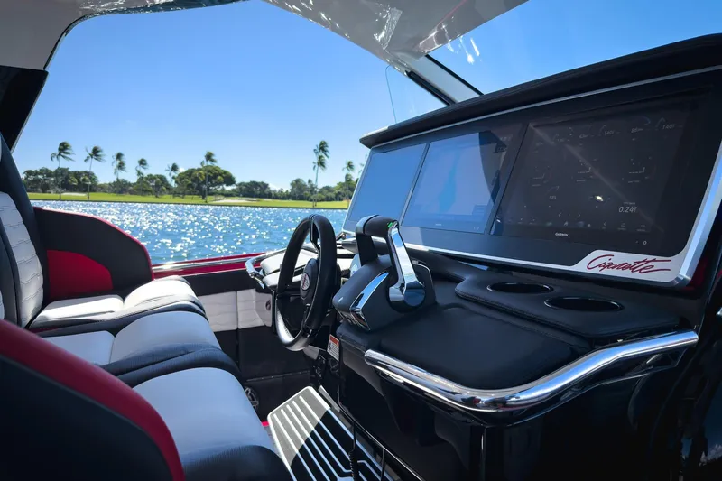 Slide: The Image of Interior of 2025 Cigarette 41 Nighthawk boat with modern dashboard and scenic water view. - 67