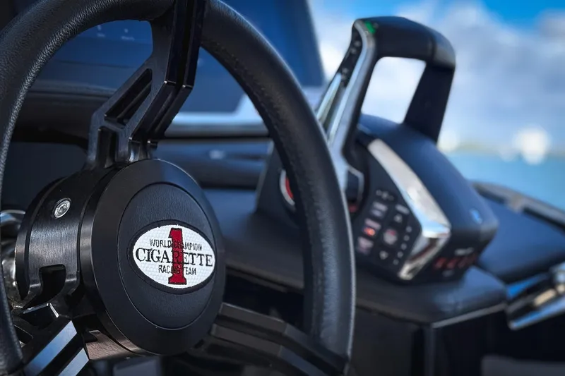 Slide: The Image of Steering wheel and controls of 2025 Cigarette 41 Nighthawk boat. - 69