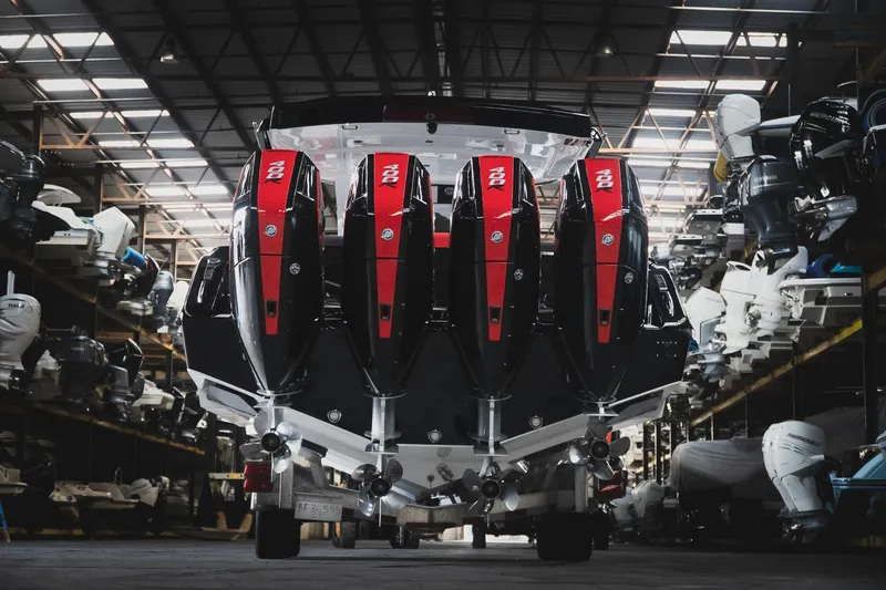 Slide: The Image of 2025 Cigarette 41 Nighthawk with quad engines in a boat storage facility. - 72