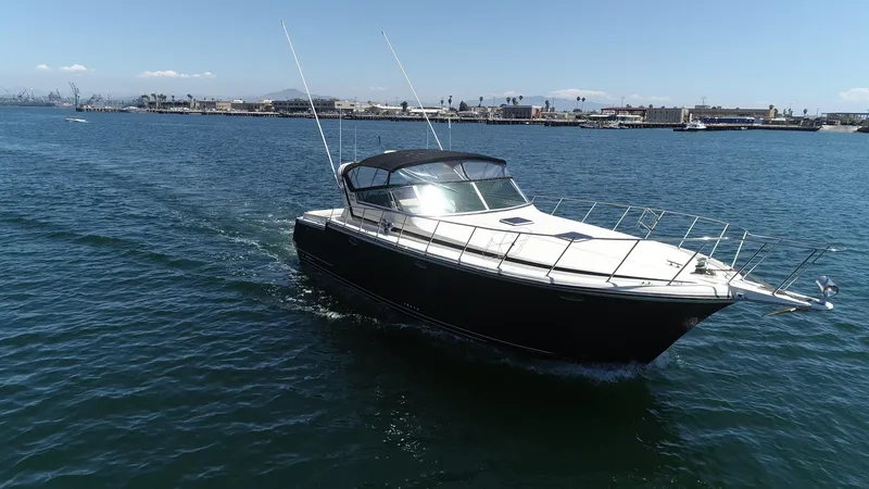 Slide: The Image of 1988 Californian Veneti boat cruising on open water under clear skies. - 11