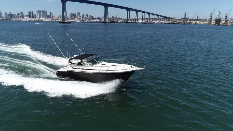 Slide: The Image of 1988 Californian Veneti boat cruising near a bridge on a sunny day. - 14