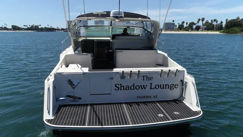 Slide: The Image of 1988 Californian Veneti boat named "The Shadow Lounge" on water, rear view. - 18