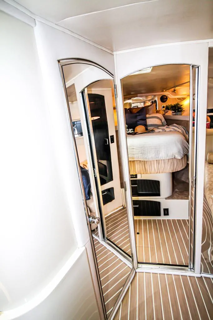Slide: The Image of 1988 Californian Veneti yacht interior with mirrored doors and cozy bedroom. - 19