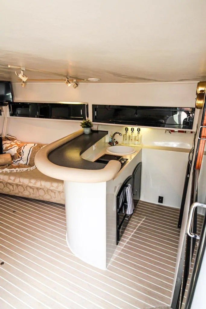Slide: The Image of Interior of 1988 Californian Veneti yacht with modern kitchen and cozy seating area. - 21