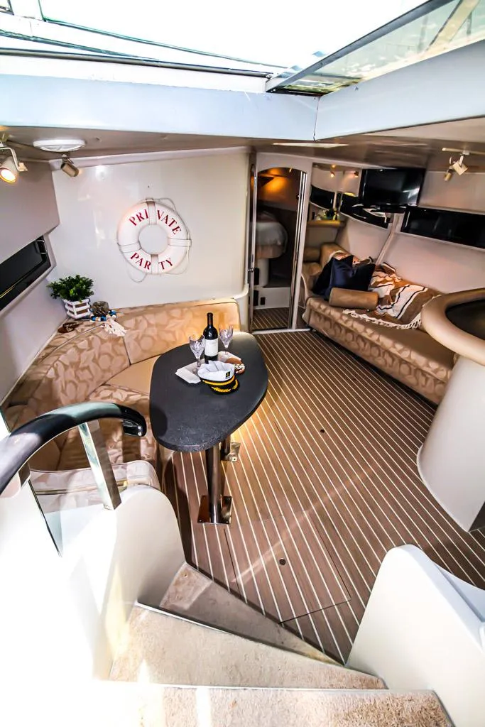 Slide: The Image of Interior of 1988 Californian Veneti yacht with elegant seating and dining area. - 22