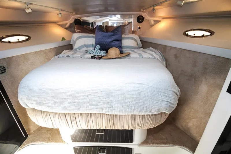 Slide: The Image of Cozy cabin interior of 1988 Californian Veneti boat with comfortable bed and nautical decor. - 28