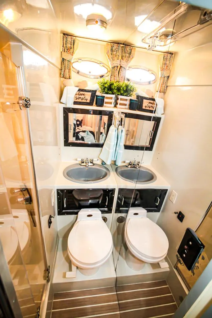 Slide: The Image of Luxurious 1988 Californian Veneti bathroom with dual sinks and toilets, elegant decor, and modern fixtures. - 33