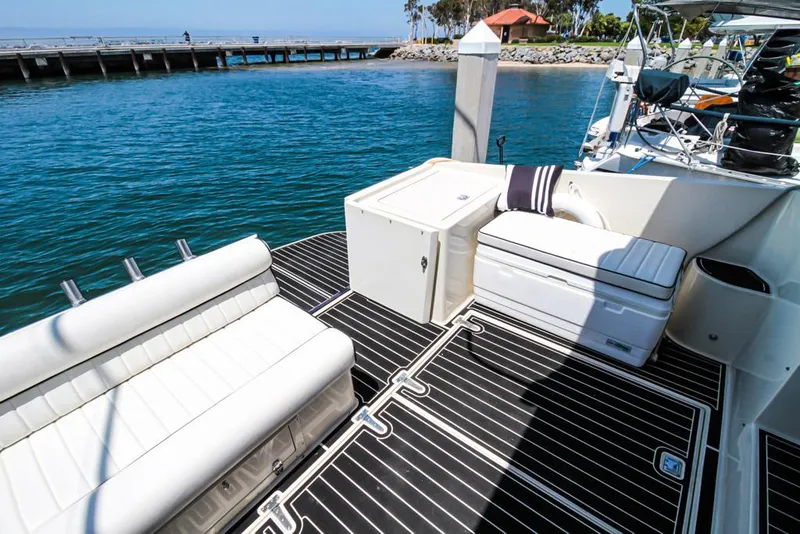 Slide: The Image of Luxury deck of 1988 Californian Veneti yacht with white seating and ocean view. - 38