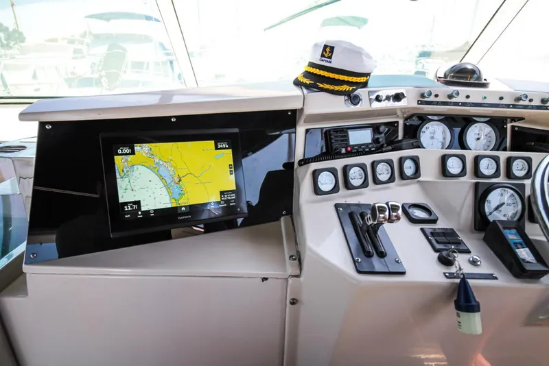 Slide: The Image of Captain's helm of 1988 Californian Veneti yacht with navigation screen and controls. - 43