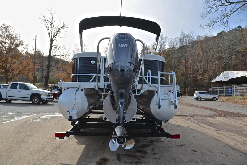 Slide: The Image of 2025 Bennington 22 S pontoon boat with 150 HP engine on trailer. - 13