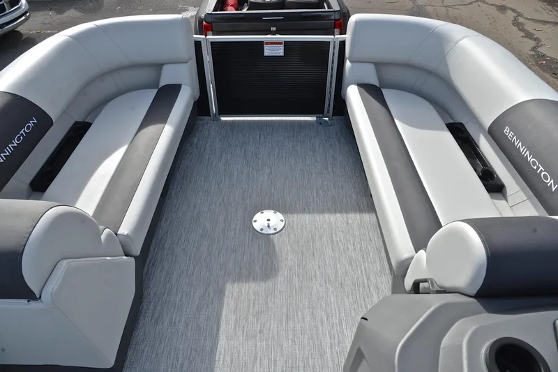 Slide: The Image of 2025 Bennington 22 S pontoon boat interior with gray seating and flooring. - 21