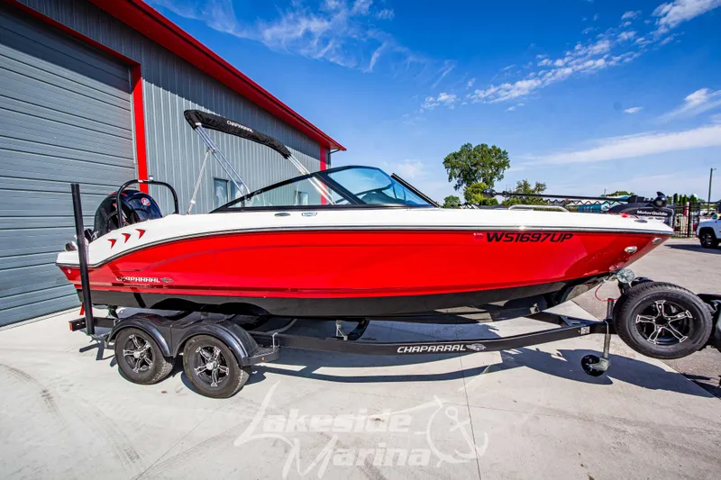 The Image of 2025 Chaparral 21 SSi Ski & Fish OB boat in vibrant red on trailer. - 1