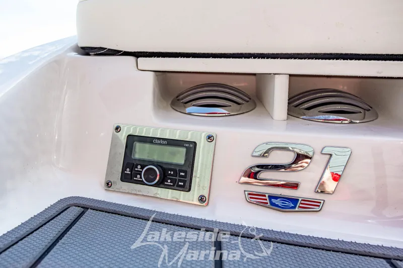 Slide: The Image of 2025 Chaparral 21 SSi Ski & Fish OB boat dashboard with Clarion stereo system. - 11