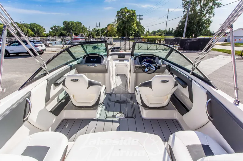 Slide: The Image of 2025 Chaparral 21 SSi Ski & Fish OB boat interior, featuring sleek seating and modern dashboard. - 13