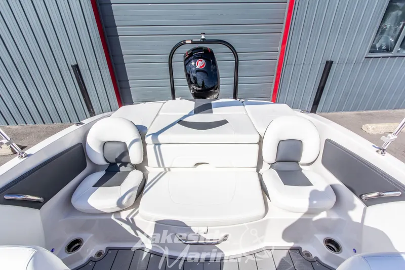 Slide: The Image of 2025 Chaparral 21 SSi Ski & Fish OB boat interior with seating and motor. - 14