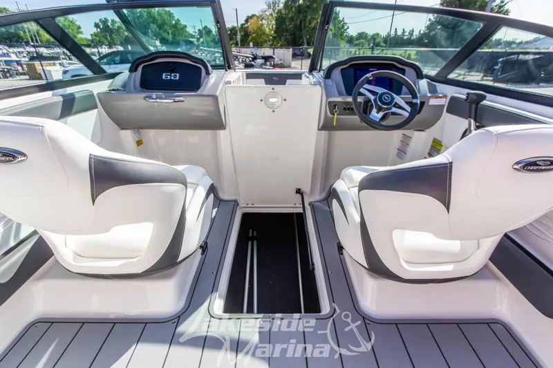 Slide: The Image of 2025 Chaparral 21 SSi Ski & Fish OB boat interior with dual seats and steering console. - 19