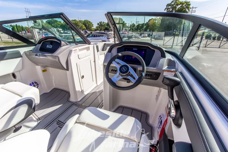 Slide: The Image of 2025 Chaparral 21 SSi Ski & Fish OB boat interior with modern dashboard and seating. - 20
