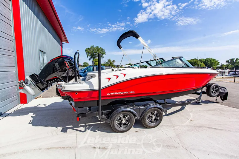 Slide: The Image of 2025 Chaparral 21 SSi Ski & Fish OB boat on trailer, vibrant red and white design. - 3