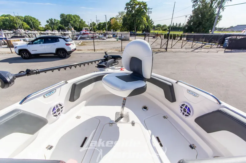 Slide: The Image of 2025 Chaparral 21 SSi Ski & Fish OB boat interior with seating and speakers. - 32