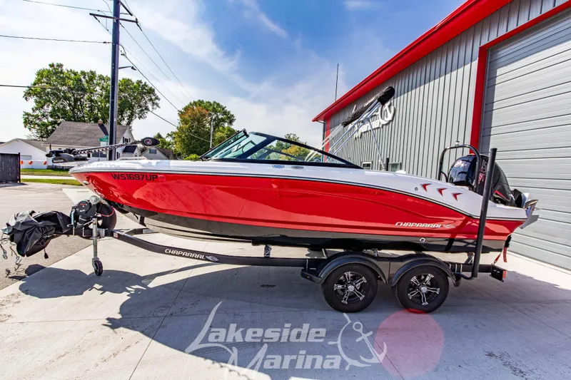 Slide: The Image of 2025 Chaparral 21 SSi Ski & Fish OB boat in vibrant red on trailer. - 7