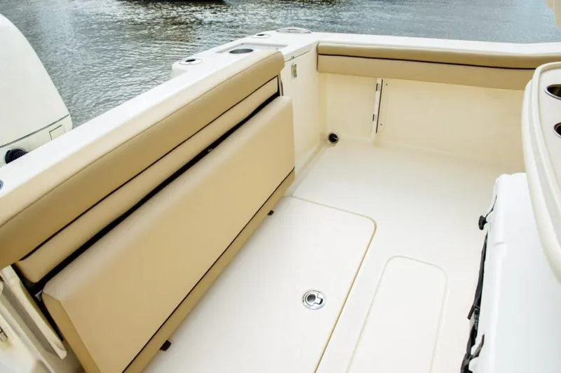 Slide: The Image of Interior view of 2020 Scout 215 XSF boat's control panel and battery compartment. - 17