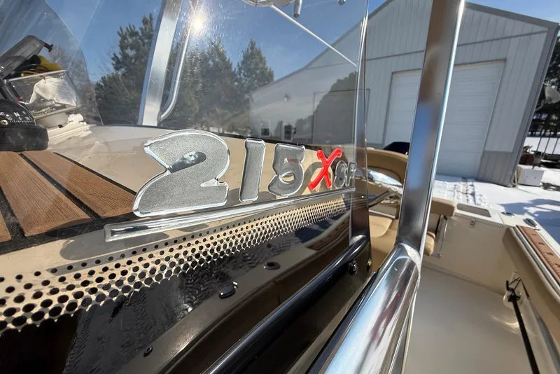 Slide: The Image of 2020 Scout 215 XSF boat detail with logo, showcasing sleek design and craftsmanship. - 22