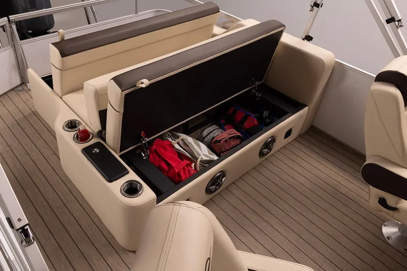 Slide: The Image of Manufacturer Provided Image: 2026 SunCatcher Fusion 324SL boat interior with open storage compartment and beige seating. - 15