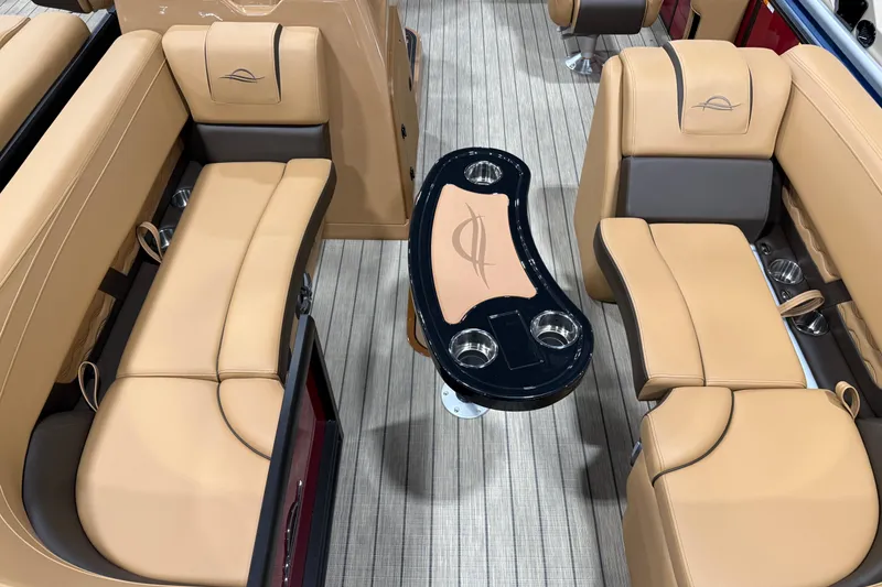 Slide: The Image of Luxurious interior of 2026 SunCatcher Fusion 324SL pontoon boat with tan seating and sleek table. - 3
