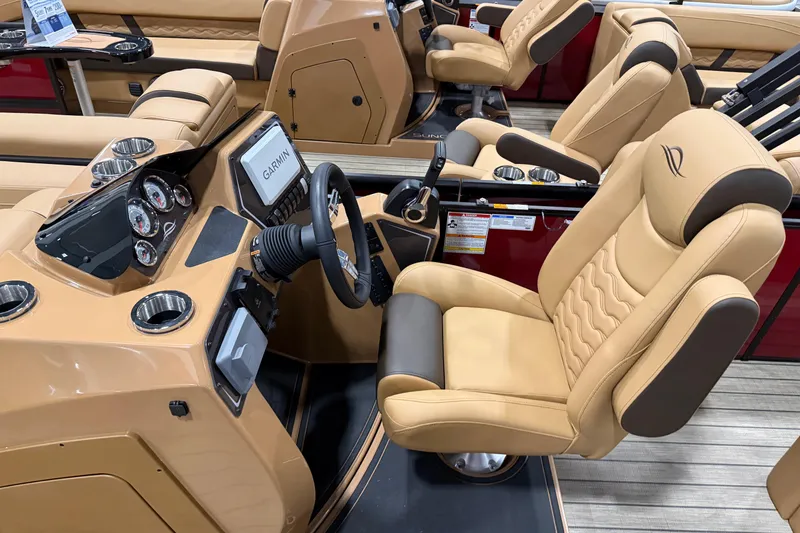 Slide: The Image of Luxurious interior of 2026 SunCatcher Fusion 324SL boat with tan leather seating and modern dashboard. - 5
