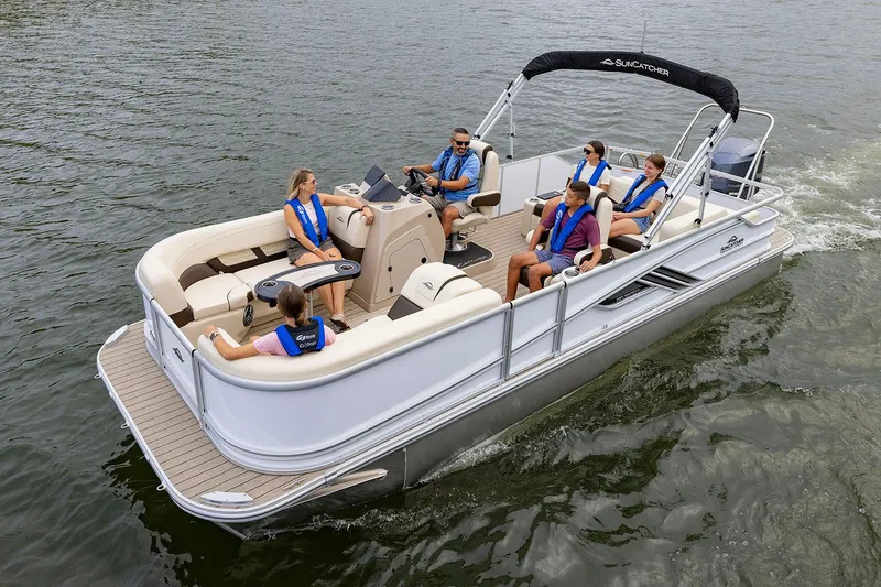 Slide: The Image of Manufacturer Provided Image: 2026 SunCatcher Fusion 324SL pontoon boat cruising with passengers on a lake. - 9