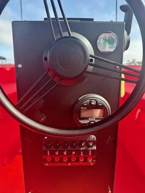 Slide: The Image of Steering console of 2023 Vision Marine Technologies Volt 180 boat, featuring gauges and controls. - 4