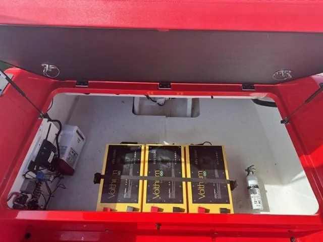 Slide: The Image of 2023 Vision Marine Technologies Volt 180 battery compartment with three Volt lithium batteries. - 5
