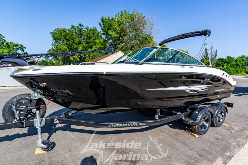 The Image of 2025 Chaparral 21 SSi Ski & Fish boat on trailer at Lakeside Marina. - 1