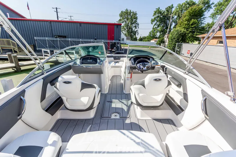 Slide: The Image of 2025 Chaparral 21 SSi Ski & Fish boat interior with modern seating and steering wheel. - 14