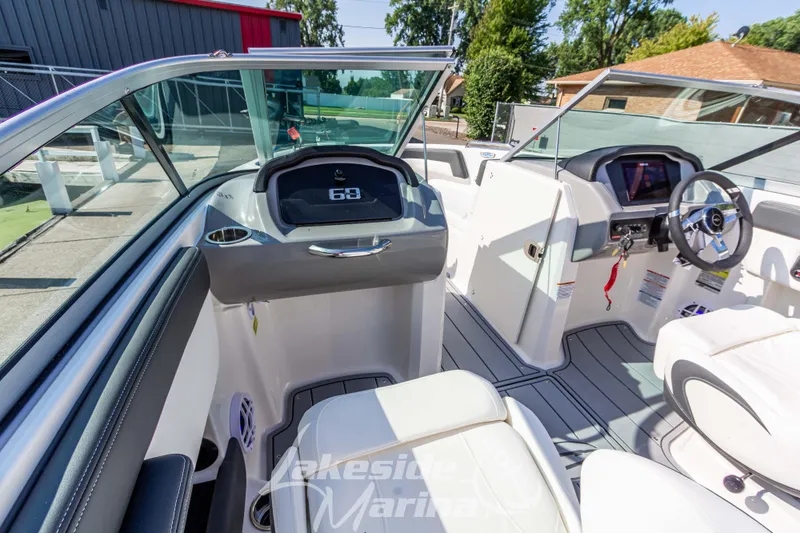 Slide: The Image of 2025 Chaparral 21 SSi Ski & Fish boat interior with modern dashboard and seating. - 23