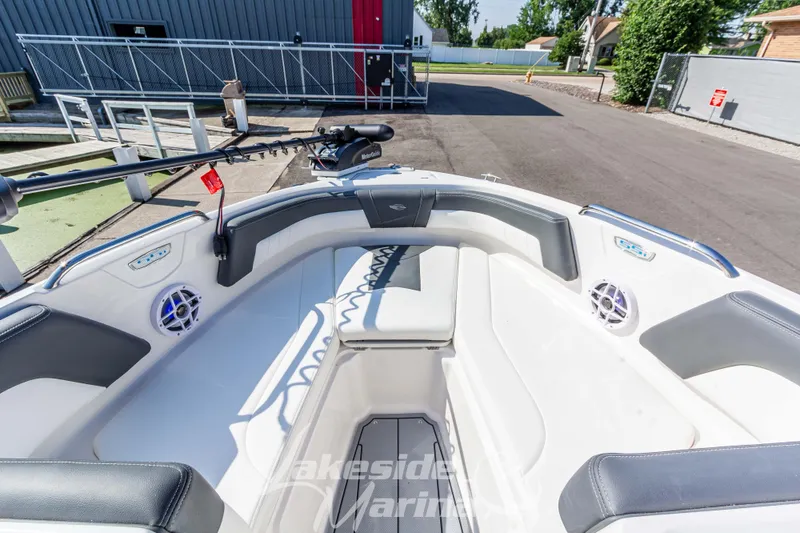 Slide: The Image of 2025 Chaparral 21 SSi Ski & Fish boat interior with seating and fishing equipment. - 29