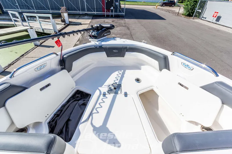 Slide: The Image of 2025 Chaparral 21 SSi Ski & Fish boat interior with open storage compartments. - 32