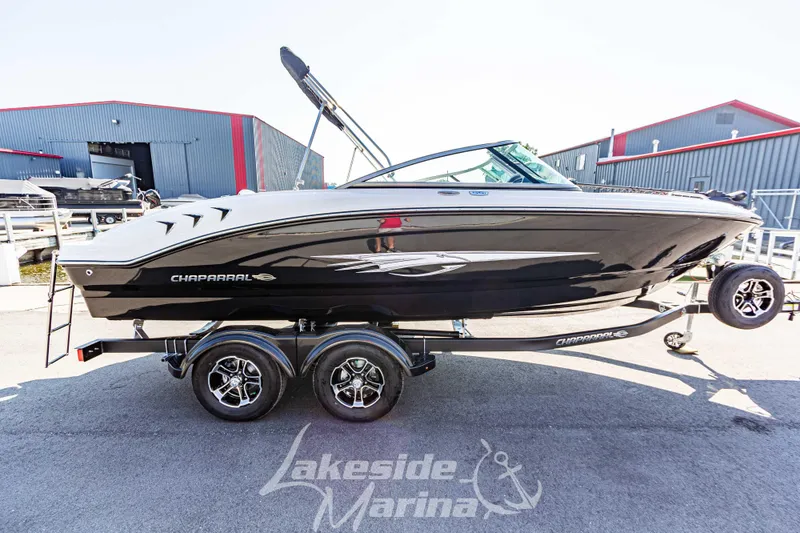 Slide: The Image of 2025 Chaparral 21 SSi Ski & Fish boat on trailer at marina. - 8