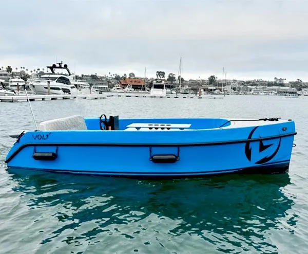 The Image of 2023 Vision Marine Technologies Volt 180 electric boat on calm water, marina background. - 0