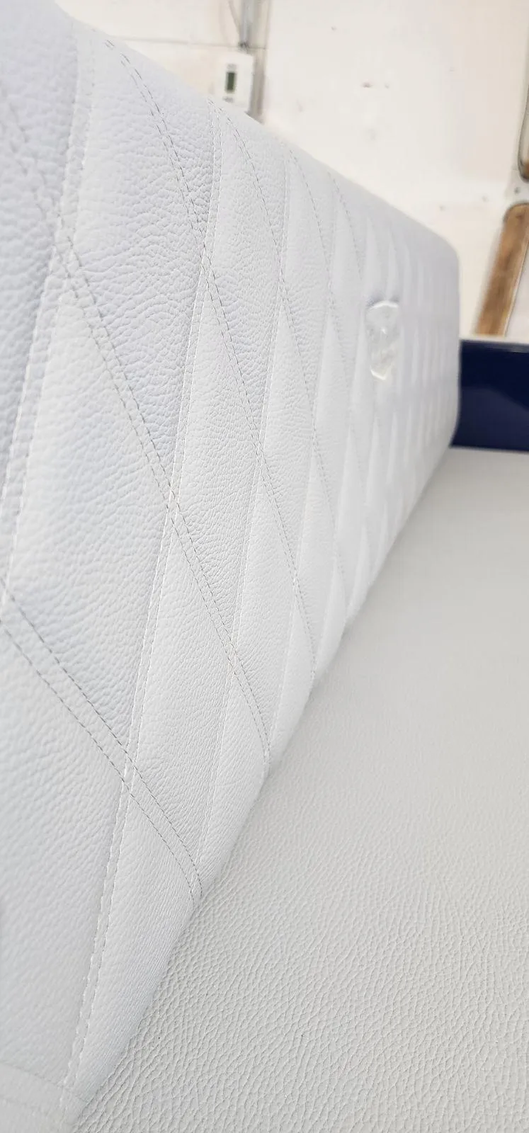 Slide: The Image of Quilted white leather seat detail in 2023 Vision Marine Technologies Volt 180. - 11