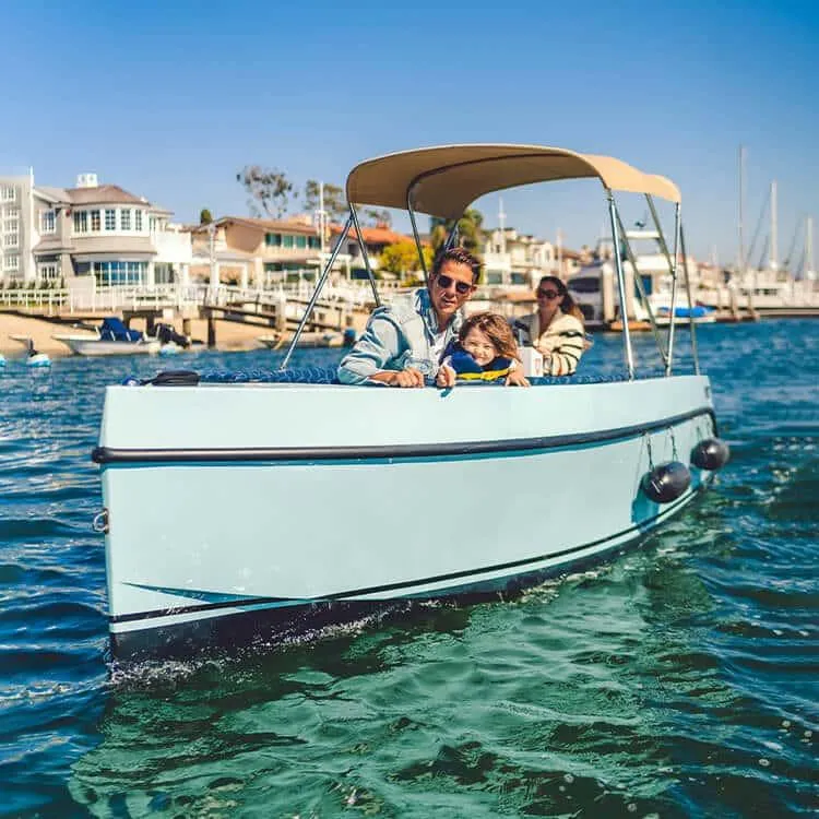 Slide: The Image of 2023 Vision Marine Technologies Volt 180 boat with family cruising on a sunny day. - 8
