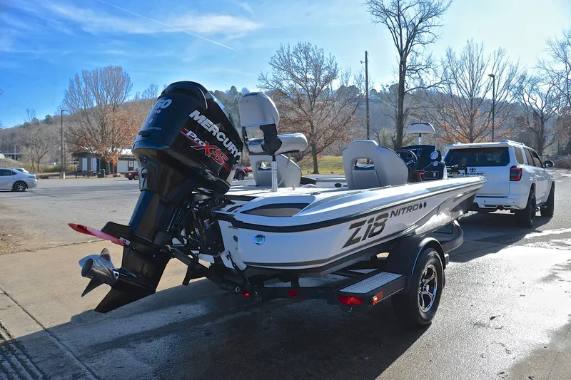 Slide: The Image of 2018 Nitro Z18 Pro boat with Mercury engine on trailer in parking lot. - 14
