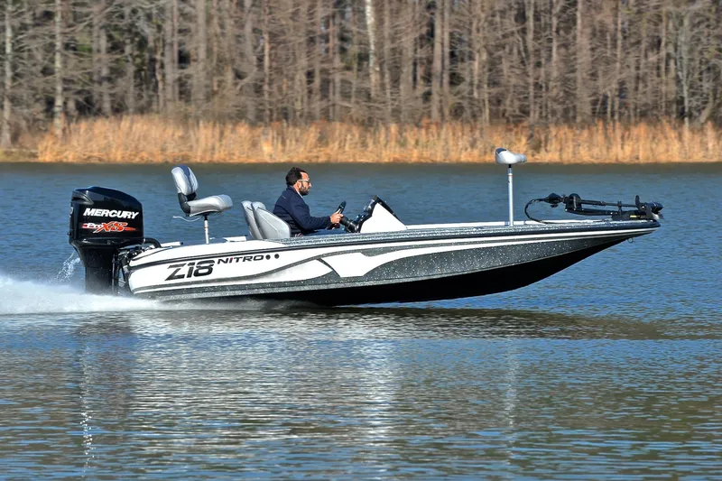 Slide: The Image of 2018 Nitro Z18 Pro boat speeding on a lake with Mercury engine. - 3