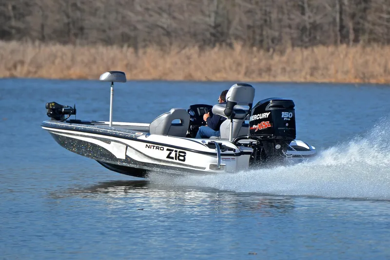 Slide: The Image of 2018 Nitro Z18 Pro boat speeding on a lake with Mercury engine. - 4