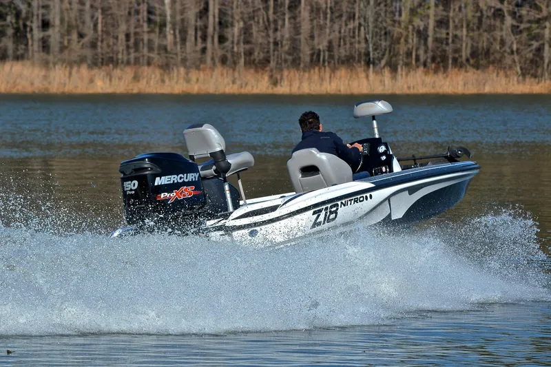 Slide: The Image of 2018 Nitro Z18 Pro boat speeding on a lake with Mercury Pro XS engine. - 5
