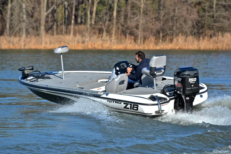 Slide: The Image of 2018 Nitro Z18 Pro boat speeding on a lake with a Mercury 150 Pro engine. - 6