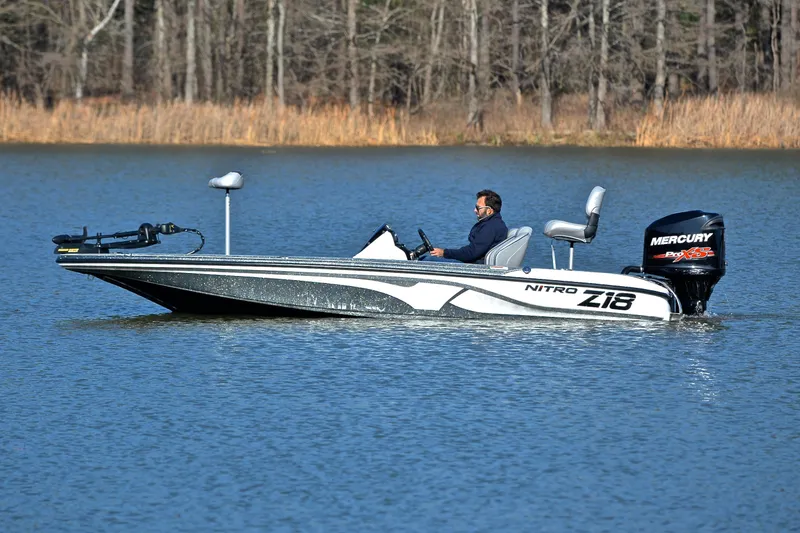 Slide: The Image of 2018 Nitro Z18 Pro boat on a lake with Mercury engine. - 9