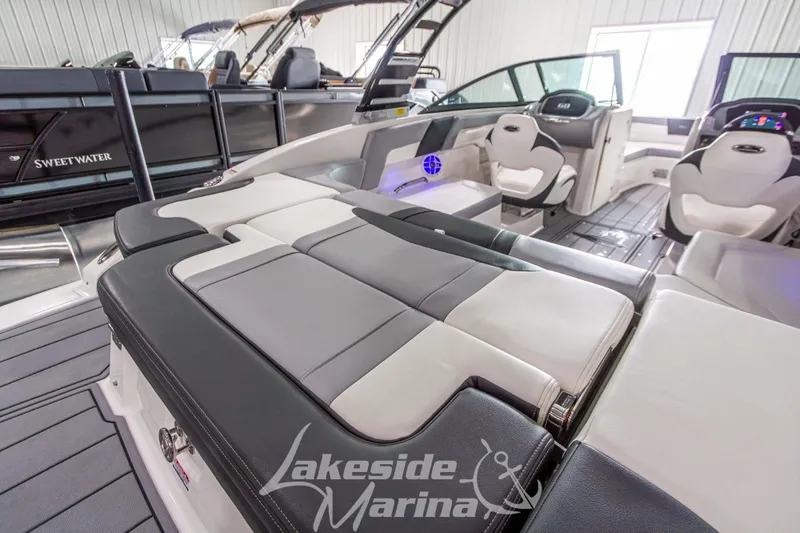 Slide: The Image of 2025 Chaparral 23 SSi boat interior with luxurious seating at Lakeside Marina. - 10